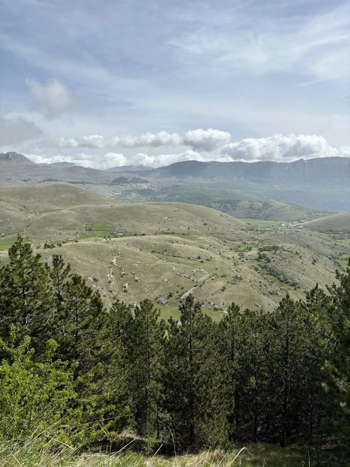 Open mountain panorama with rolling green highlands and distant ridges